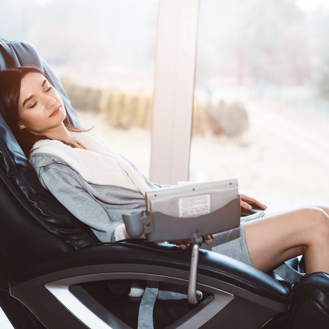 Asian woman relaxing on a massage chair